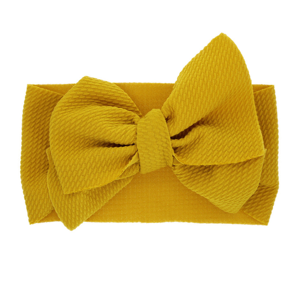 Newborn baby's solid-coloured bow headband