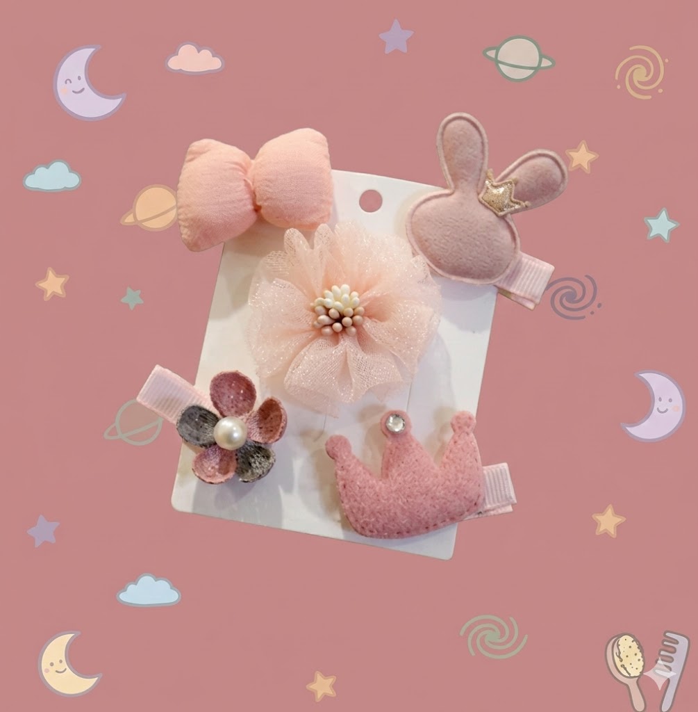 Set of pink hair accessories including bows and flowers on a card 