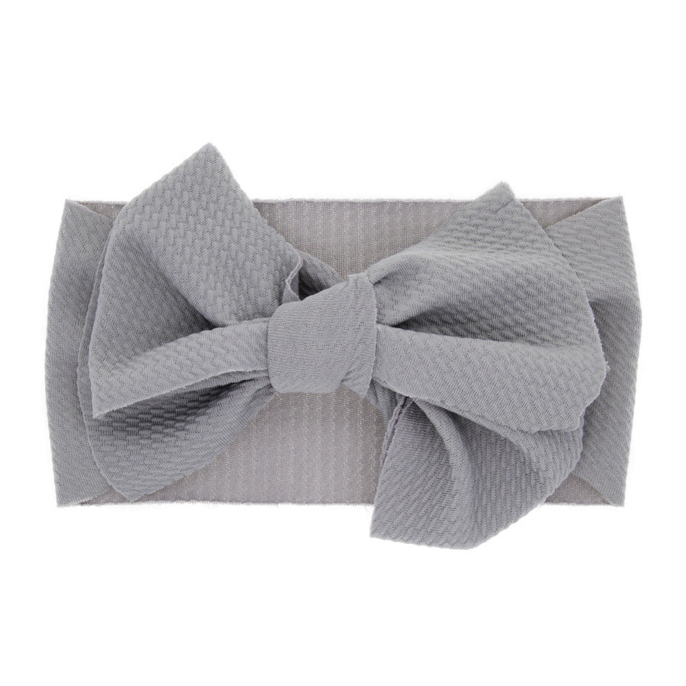 Newborn baby's solid-coloured bow headband