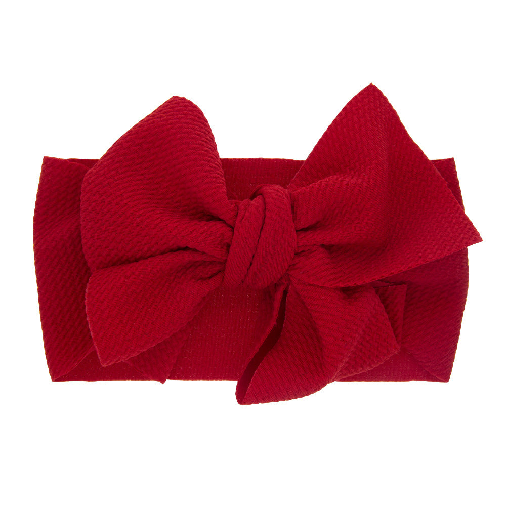 Newborn baby's solid-coloured bow headband