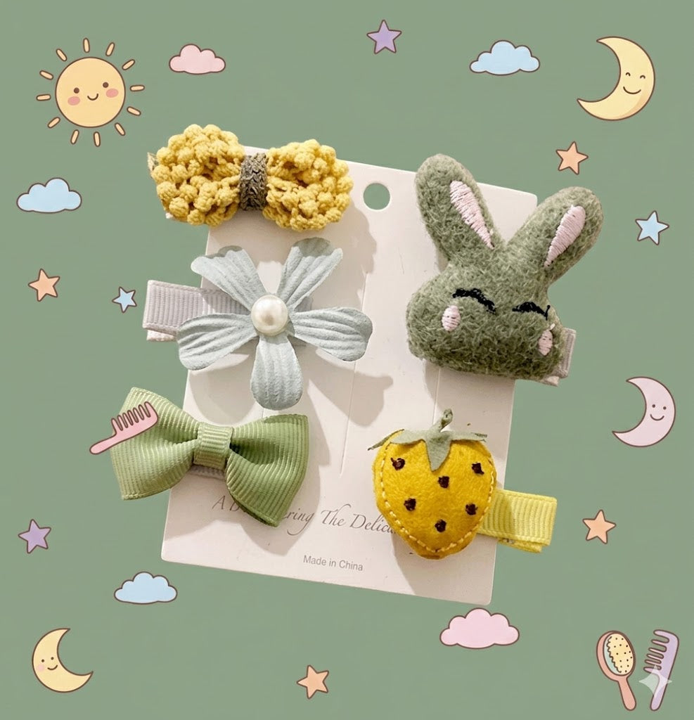 Set of children's hair accessories including bows and a rabbit design on a sage background