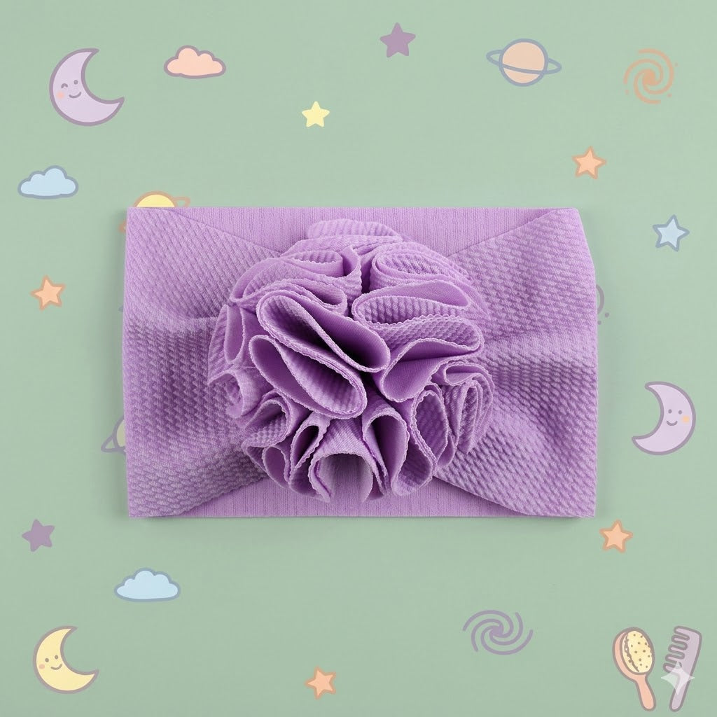 Purple textured headwrap with a floral design on a green background