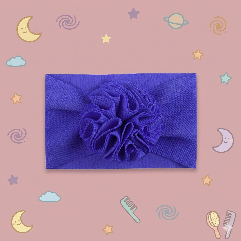 Blue headband with floral design on a pink background