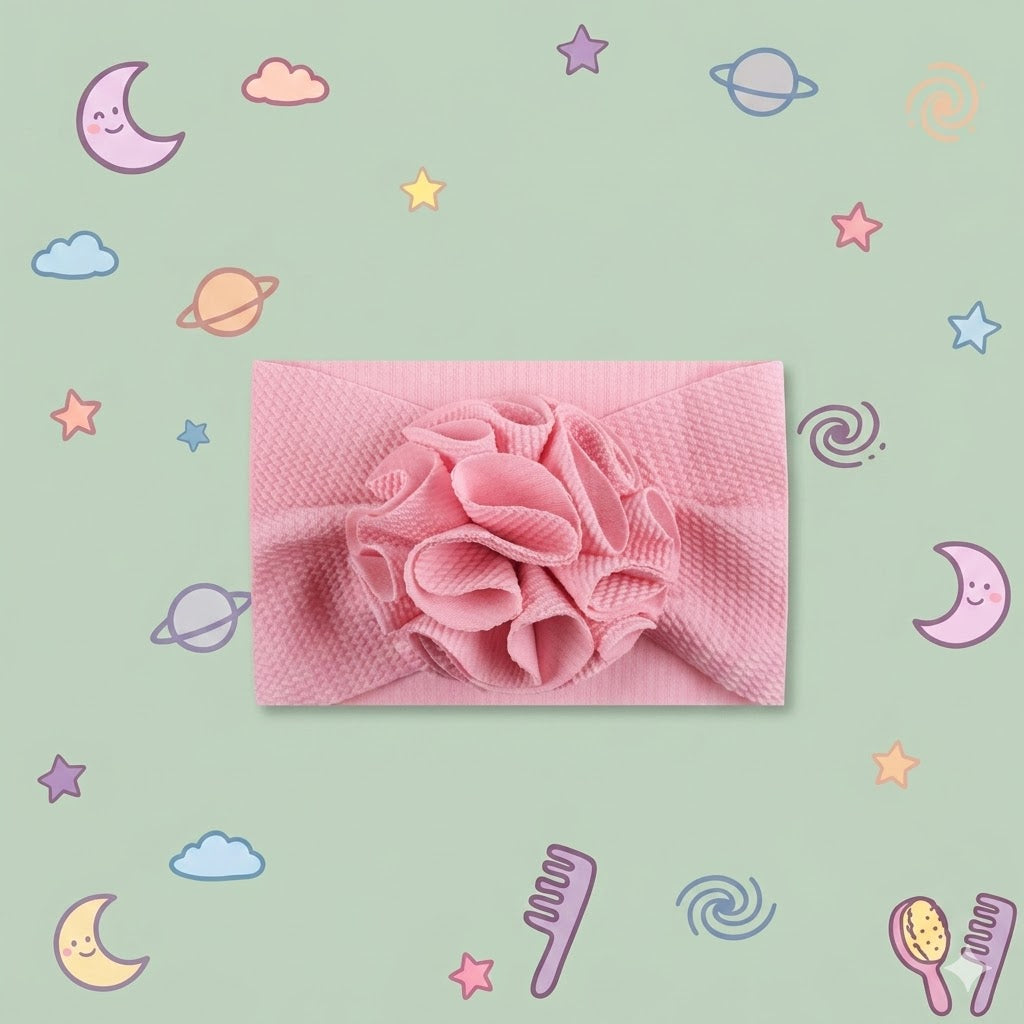 Pink headband with a flower on a green background