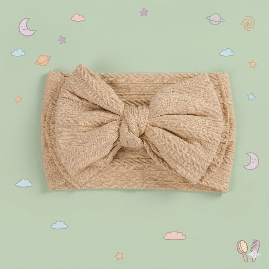 Beige headband with a large bow