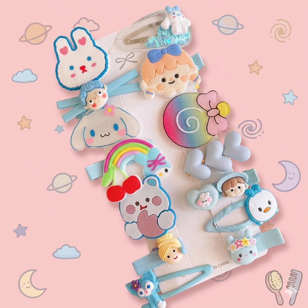 Set of colorful children's hair accessories on a pink background with cartoon illustrations.