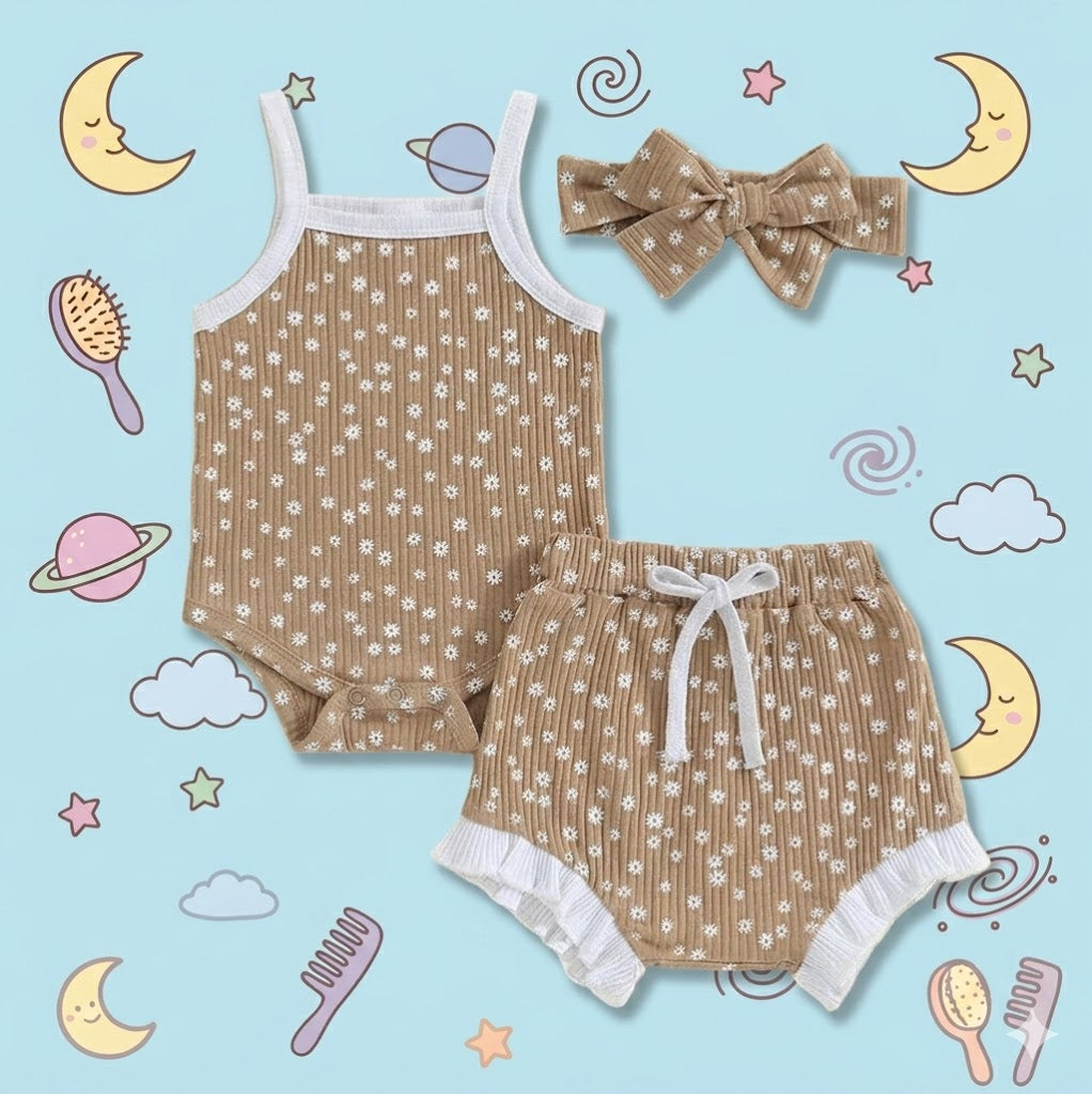 Children's outfit with top and shorts on a blue background with cartoon elements.